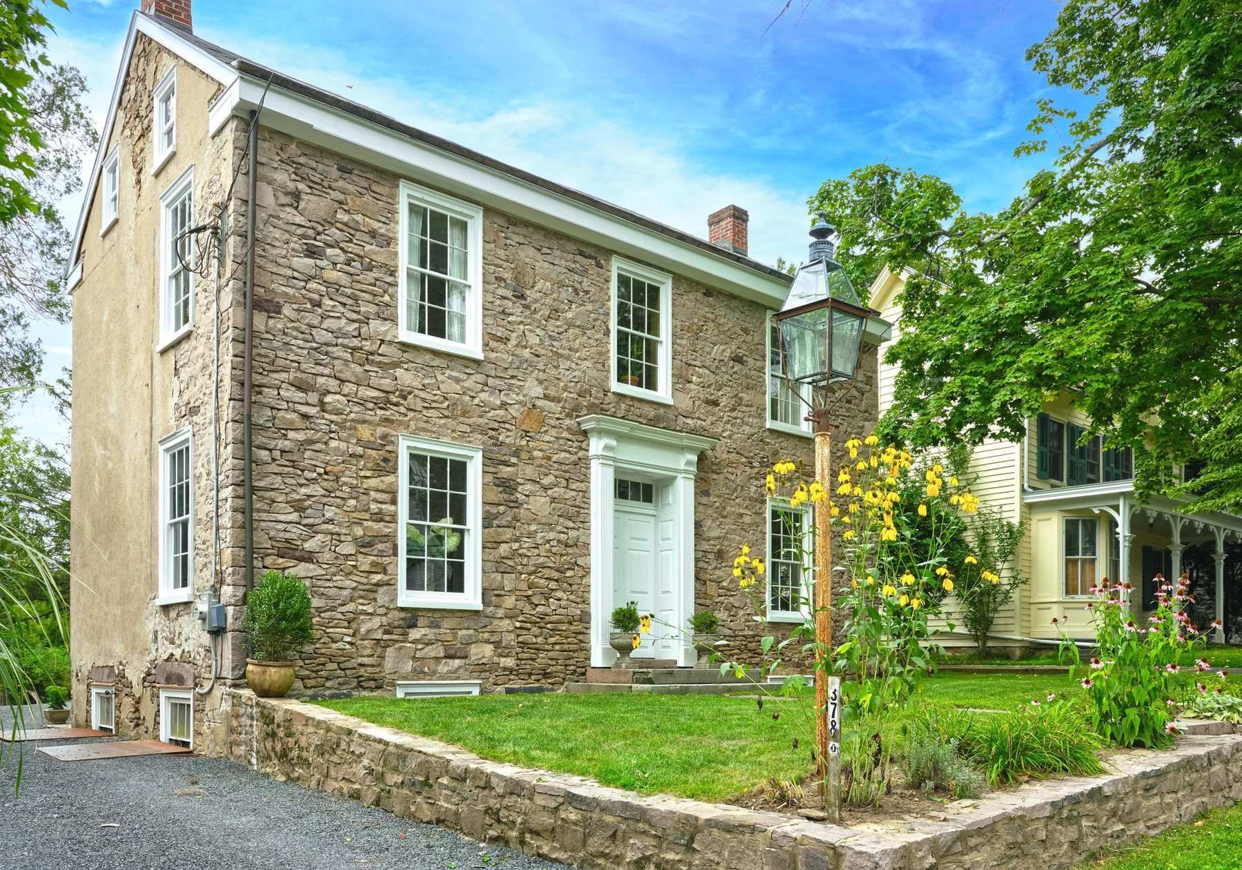 3786 Aquetong Road, Carversville, a stone colonial with a lantern post and garden